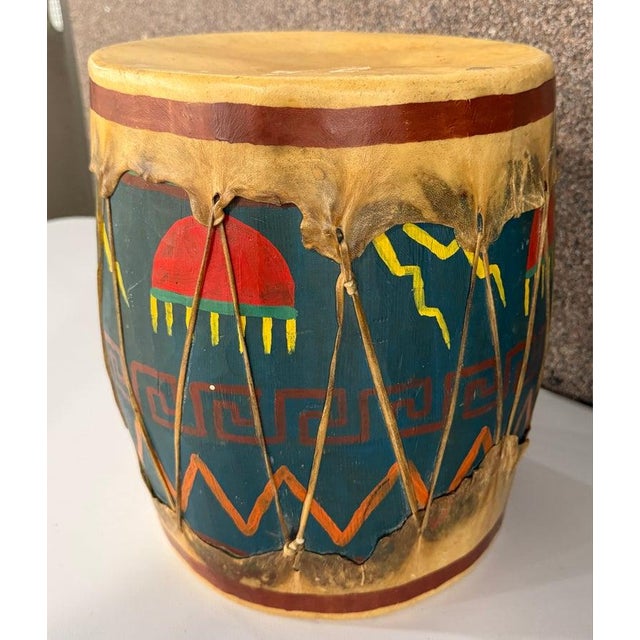 Mid Century hand made wooden Zuni Pueblo Tom Tom Drum with leather Top and straps. The hand drawn artistry on the drum is...