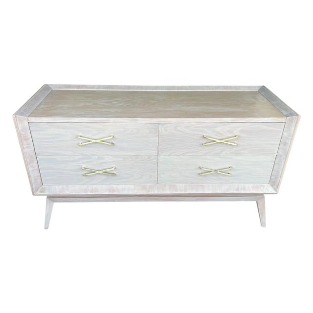 This exceptional vintage Mid-Century Modern chest of drawers in the manner of designer Paul Frankl has been professionally...