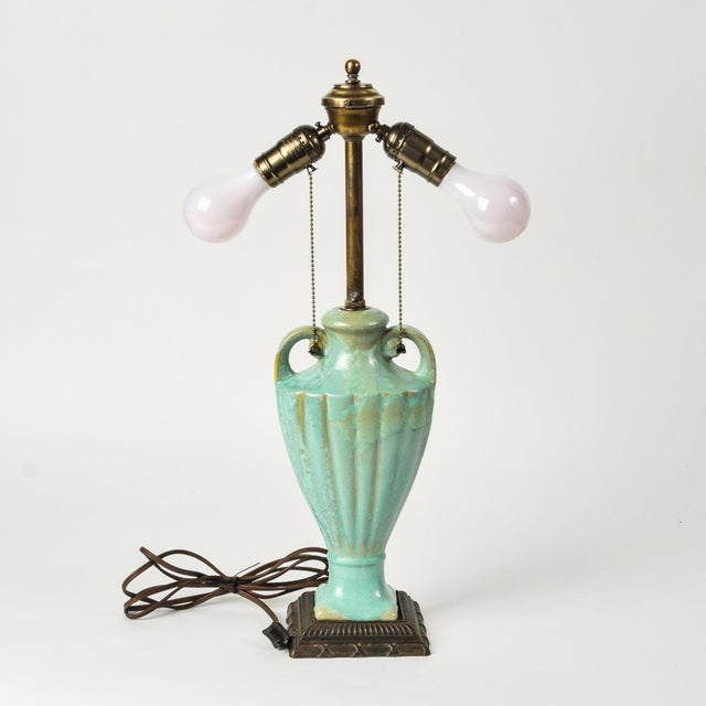 An exceptional art deco era double bulb ceramic table lamp in turquoise celadon green. Interesting imperfect glazing....