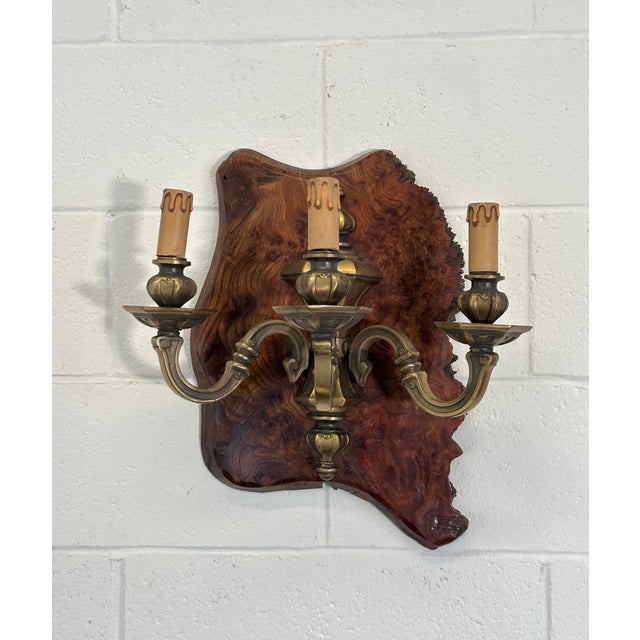 Pair of rustic wall lamps from the 60s, bronze structure and wooden base, one base measures 50h.x27 and the other 46h.x35...
