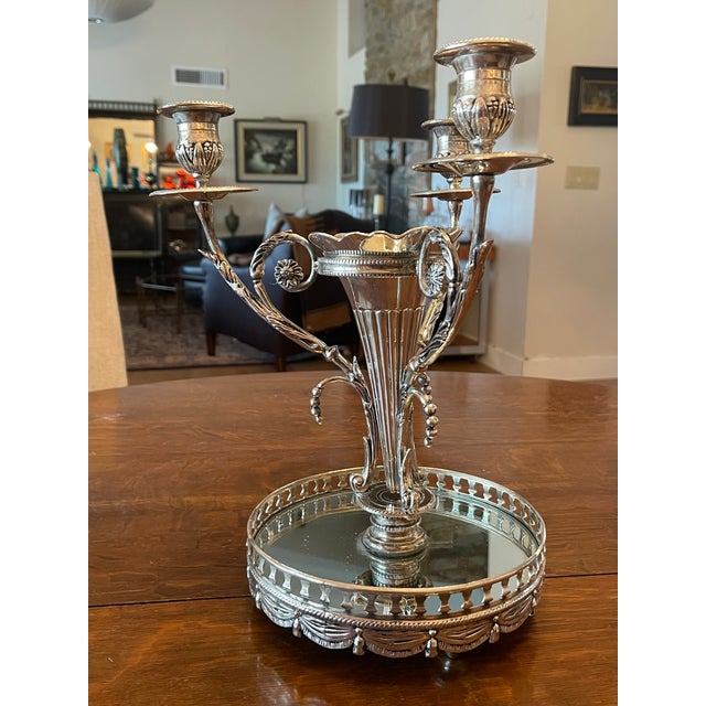 This is a vintage (1960's) Godinger silver-plated epergne centerpiece featuring a central trumpet-style flower vase...