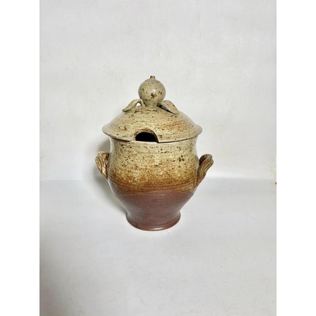 A French stoneware pot from the 1960s, signed Bodiny, perfectly illustrates the post-war ceramic aesthetic. Generously and...