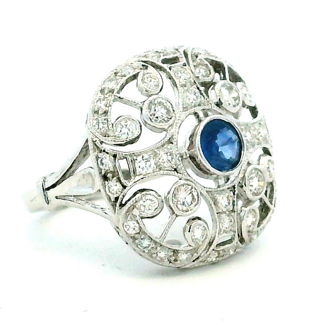 A romantic fusion of vintage charm and refined craftsmanship, this 14K white gold filigree ring features a captivating...