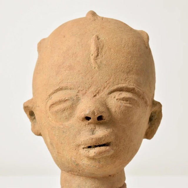 Terracotta (baked clay) heads served as funerary portraits and memorials for the Akan peoples of Ghana and for the Agni...
