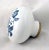 1960s white ceramic door knob with blue floral designs. The manufacturer is unknown. One available. Good condition with...
