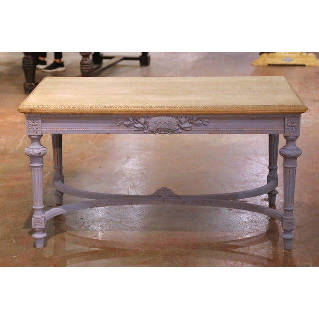 This elegant antique French writing desk dates to the mid-19th century, circa 1850, and is crafted in the refined Louis...