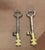 Vintage pair of skeleton keys mounted on brass bases as lamp finials.