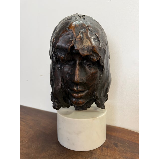 This powerful bronze head sculpture, titled The Mask, was created in 1967 by American sculptor Paul Suttman and sold...