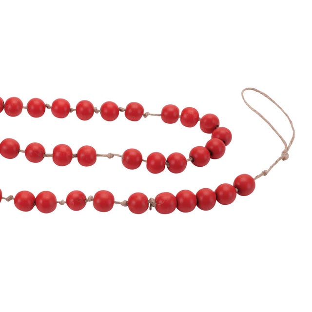 Add a rustic yet festive touch to your holiday decor with the Wood Beaded String Garland. Featuring festive red tones and...