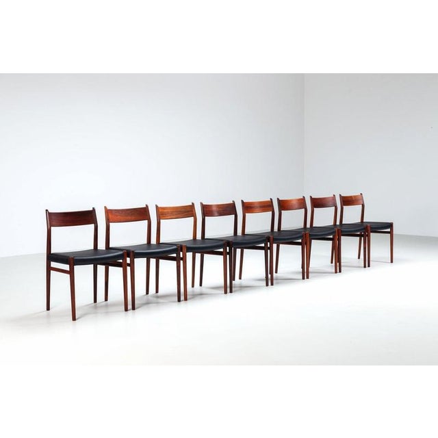 Beautiful set of eight Arne Vodder Model 418 dining chairs in rosewood, produced by Sibast Møbler, Denmark, 1960s. An...