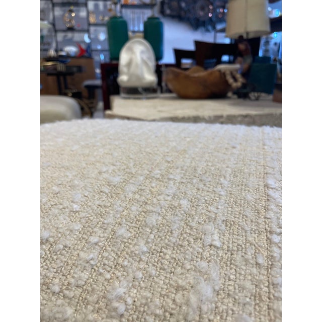 A whimsical Egyptian Revival style bench or ottoman with NEW boucle fabric. The wood is neutral and in wonderful...