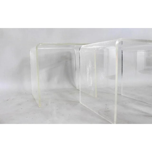 A very nice set of mid century modern Hollywood regency Lucite nesting tables They fit inside of each other