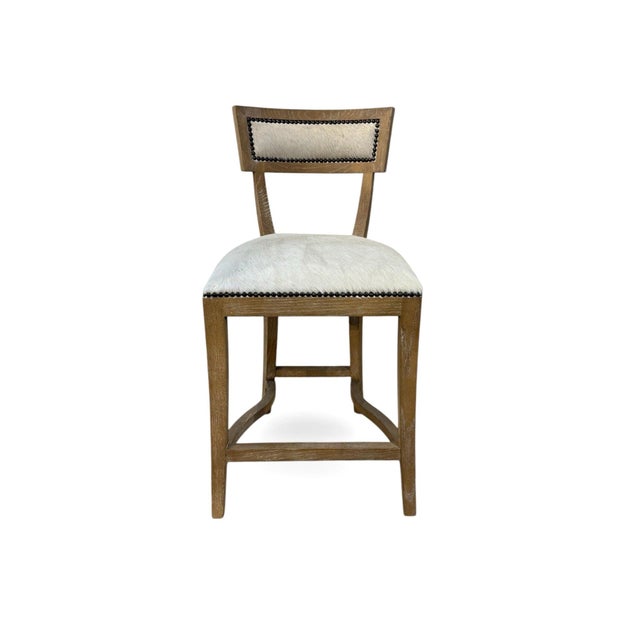 Elevate your space with this elegant bar stool, featuring a sturdy oak wood frame paired with a luxurious cowhide...