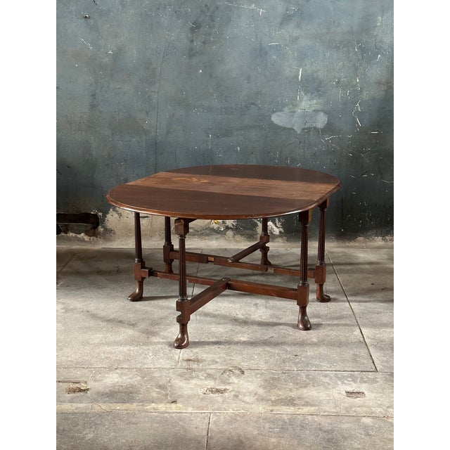 Rare and unusual 19th Century gate leg table featuring club style feet with finely carved fluted legs. High level of...