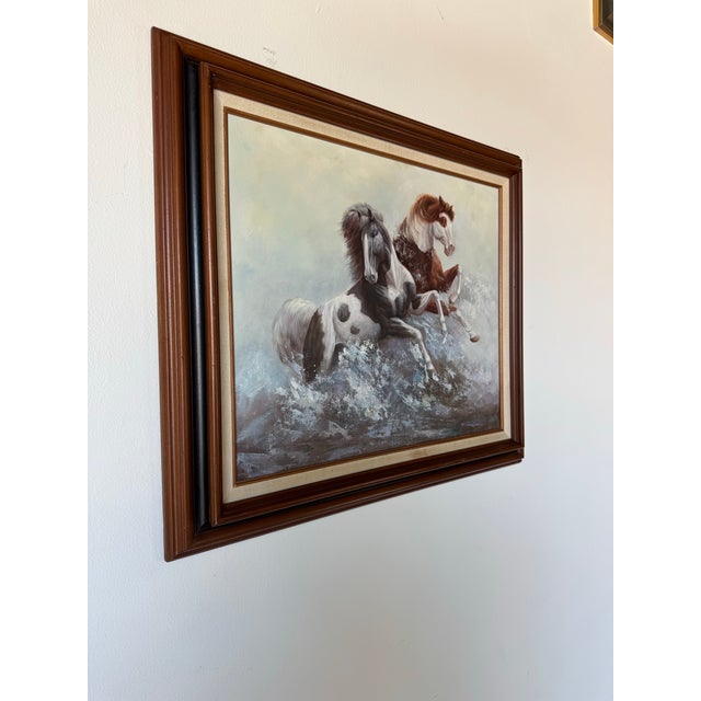 A dramatic and spirited 1970s vintage oil on canvas painting by artist Vincent, capturing two dynamic horses in mid-motion...