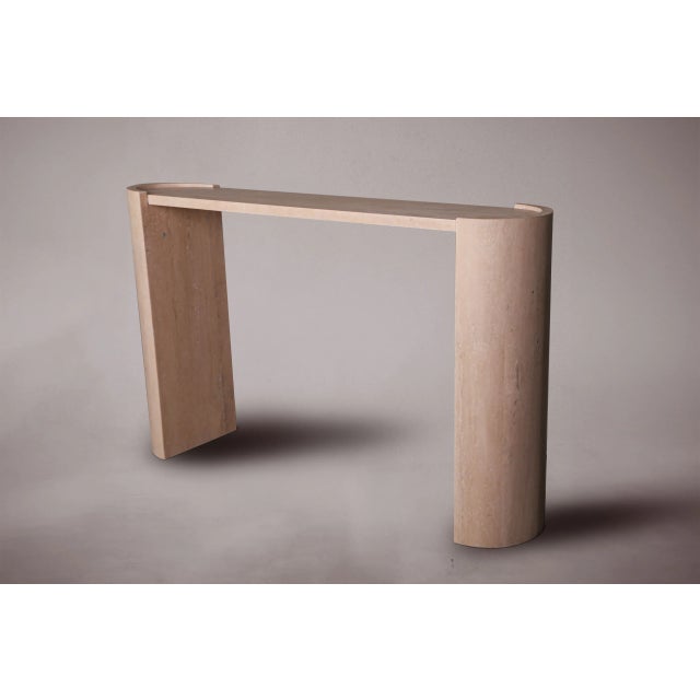 Introducing our exquisite travertine console table with a unique D-shaped design, featuring two elegantly curved legs....