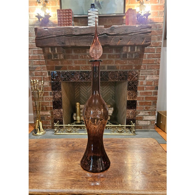 Add a touch of Mid-Century Modern elegance to your home with this stunning Amethyst Glass "Genie Bottle" Decanter. This...
