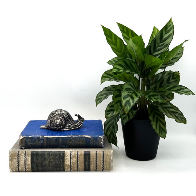 Whimsical vintage pewter snail salt shaker, beautifully detailed and full of character. This figural escargot is cast in...