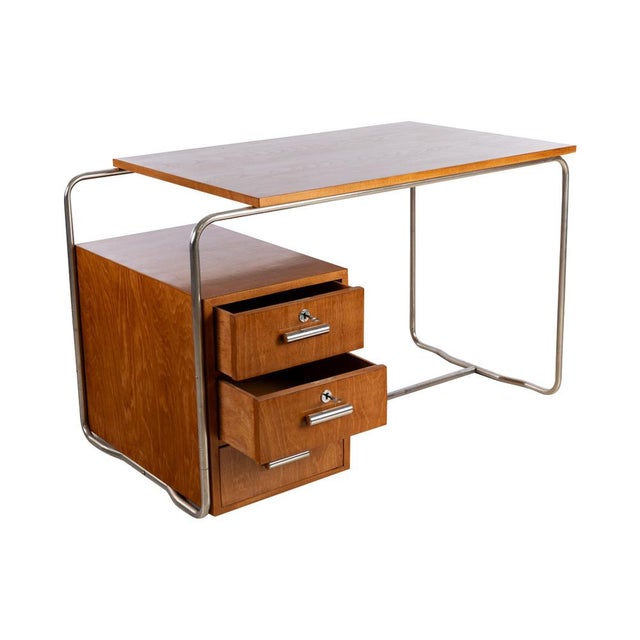 Beech veneer, shellac hand-polished, chrome-plated tubular steel.