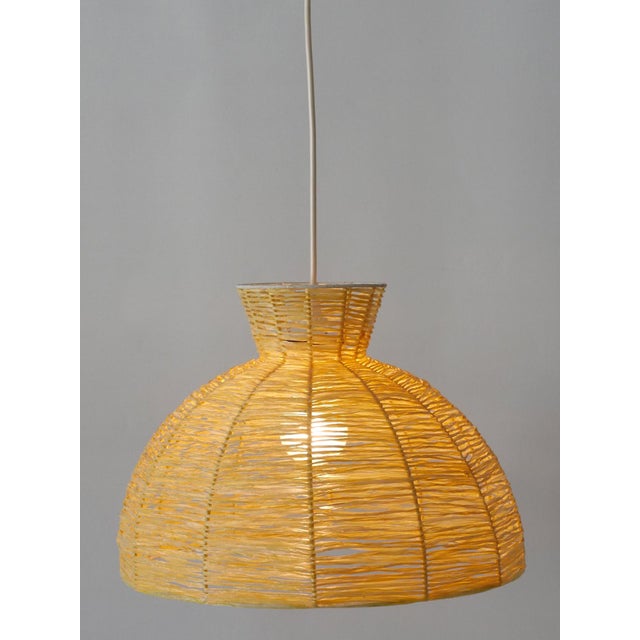 Rare, elegant and highly decorative Mid-Century Modern pendant lamp / hanging light. Manufactured in Germany, 1970s....