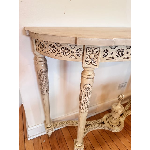 Superb louis XVI console in lase and rechampi wood around 1880. Abundant decorations of relief sculptures. Rests on 4 feet...