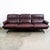 Rarely seen leather sofa designed Attributed to Arne Norell, This piece offers supple burgundy leather over solid metal /...