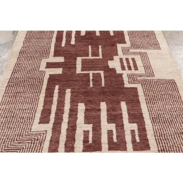 This 5x9 contemporary French Art Deco rug features a bold architectural design framed by geometric linear motifs. Hand-...