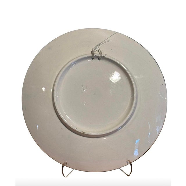 Charming mid-20th century blue and white scenic charger featuring a classic Dutch windmill landscape with shoreline,...