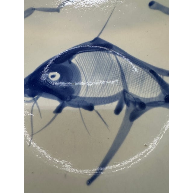 Chinoiserie hand painted noodle porcelain bowls with fish design. Some are stamped on back