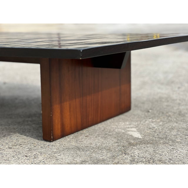 Coffee table by Axel Vervoordt, Belgium, 1980. Its low, clean lines rest on two solid supports. The dark-stained bamboo...