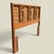 A full-size wood headboard by Bassett Furniture Industries with a clean mid-century silhouette and a warm, substantial...