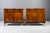 A beautiful pair of 19th-century Biedermeier side cabinets, featuring richly figured, bookmatched walnut veneer with warm...