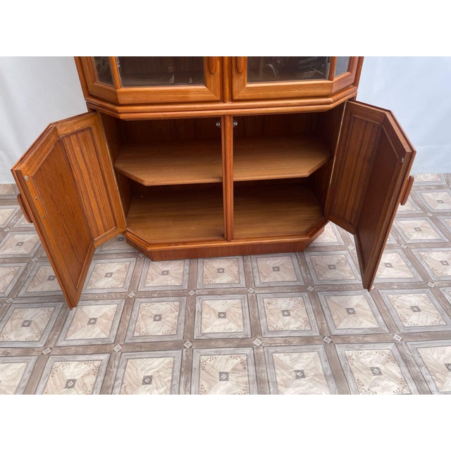 Danish-style illuminated teak display cabinet This Danish-style wooden display cabinet is made of teak. It features...