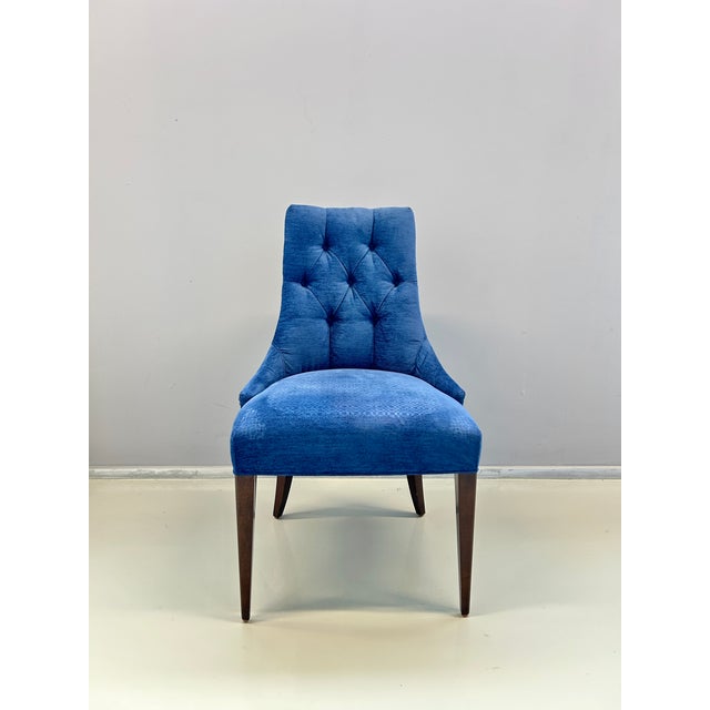 Blue and white upholstered chair with button tufting. Baker Furniture brand. This piece is attributed to the mentioned...