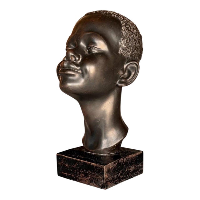 French Art Deco decorative bust, circa 1940, made of fine hollow ceramic with an ebonized wood base. Measurements: Height...