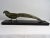 Fin shaped sculpture by H.Robert, original from the 20s, in Bronze on a high gloss lacquered wooden base. H. Robert is...