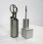 A three piece stainless Aluminum desk set with scissors , letter opener , holder , pen , holder and open tube for other...