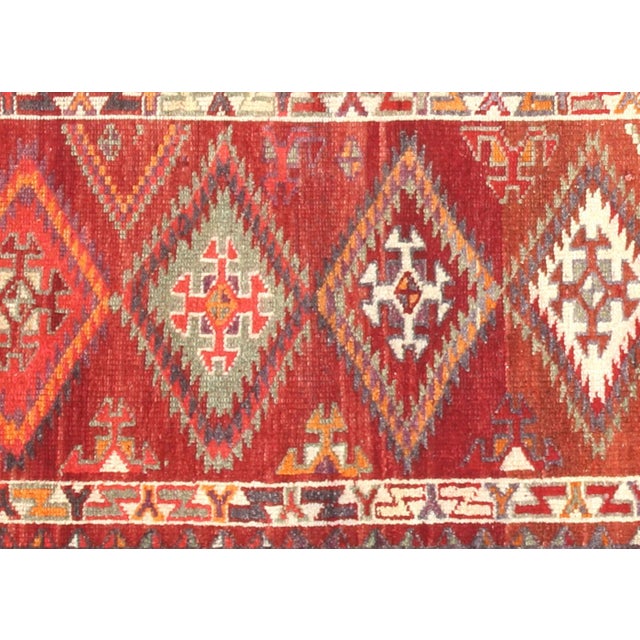 Handwoven vintage Turkish Oushak runner measuring 3' x 12'. Crafted with wool on wool foundation in Western Turkey's...
