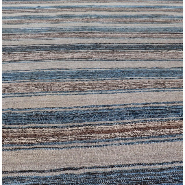 Versatile and natural blue, cream and brown flat-weave Kilim for a Modern or Classic design Flat-weave Kilim rug with...