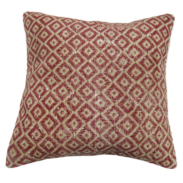 Pillow made from a Turkish Konya rug with pink linen backing and zipper closure. 17'' x 17''