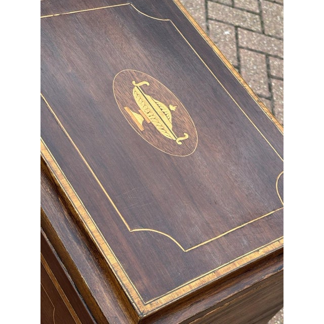 Inlaid Mahogany Wine Cellarette, Holds 12 Bottles. Sizes :- 73 cms high 46 cms wide 36 cms depth Strong & solid but a used...