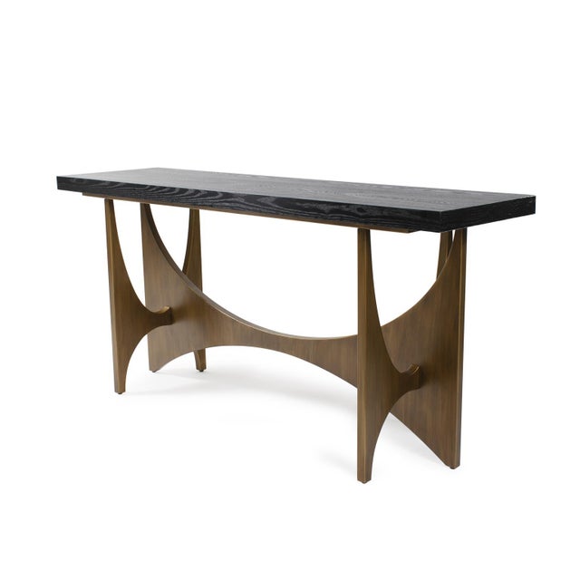 The Burton Console Table is a captivating blend of modern and mid-century design elements. Its top features a black...