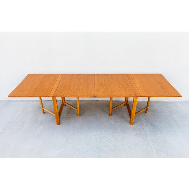 A rare and remarkably well-preserved vintage mid century Bruno Mathsson “Maria” folding dining table, produced in Sweden...