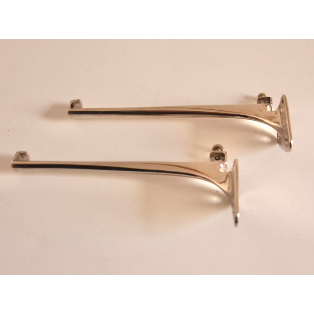 Bathroom or kitchen shelf in Bauhaus style. Original from the 1920s with newly nickel-plated brackets and white glass...