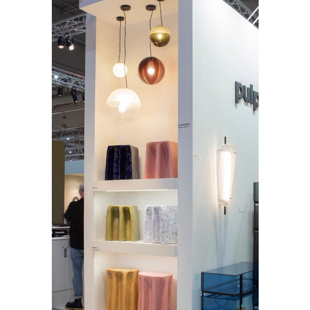 The varying structures of stellar suspension lights by Sebastian Herkner with its curved ridges and a frosted acetate...