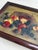 Late Victorian oil on canvas still life depicting a woven basket tipped on its side, spilling apples, grapes, plums and...