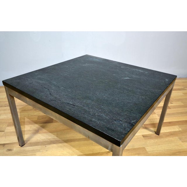 Florence designed by Florence Knoll is a coffee table made up of structure and legs in welded steel and top in marble...