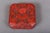 A pair of small antique Chinese decorative covered boxes: a deeply carved cinnabar lacquered box with an intricate lotus...
