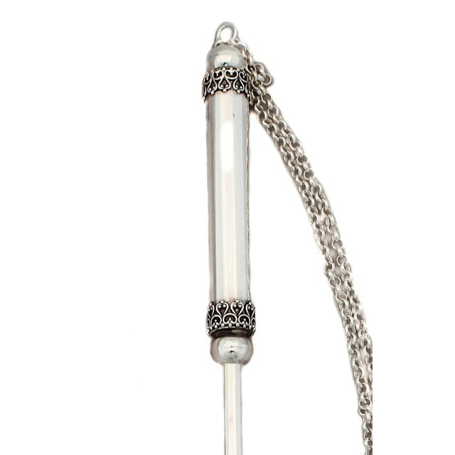 This sterling silver Torah pointer (Yad) from Israel has filigree work around the two ends of the handle and a sterling...