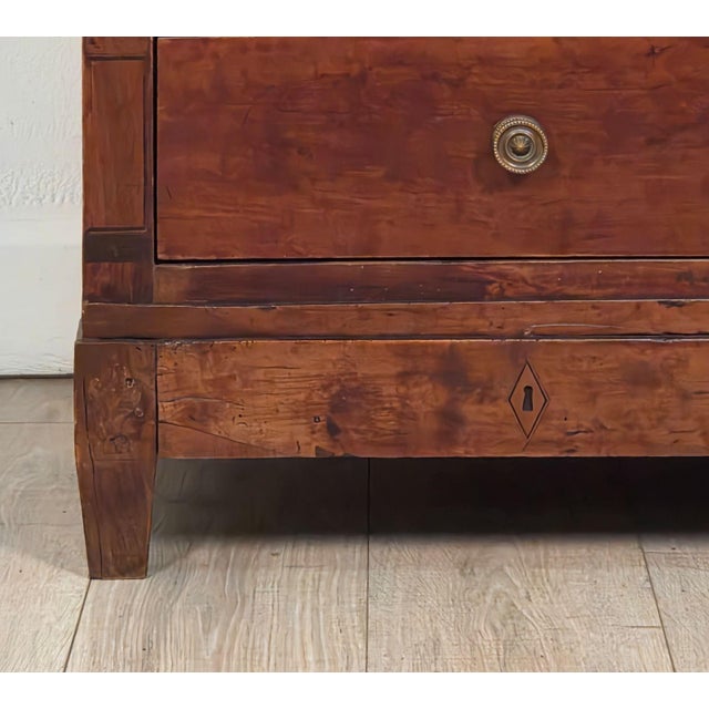 An English or American tall chest of drawers with satinwood inlay, possibly a country piece. Restoration.